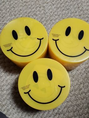 3Smiley Face Yellow Storage Containers With A Pair Of Crew Socks Inside